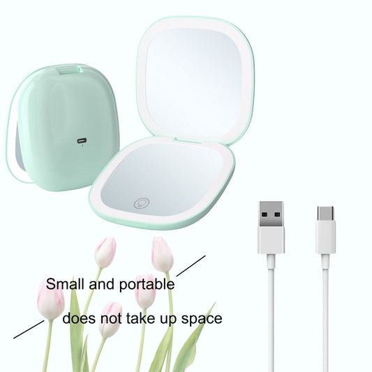 Mint green portable compact mirror with USB Type-C charging cable, shown in open and closed positions. Small, lightweight, and space-saving design.